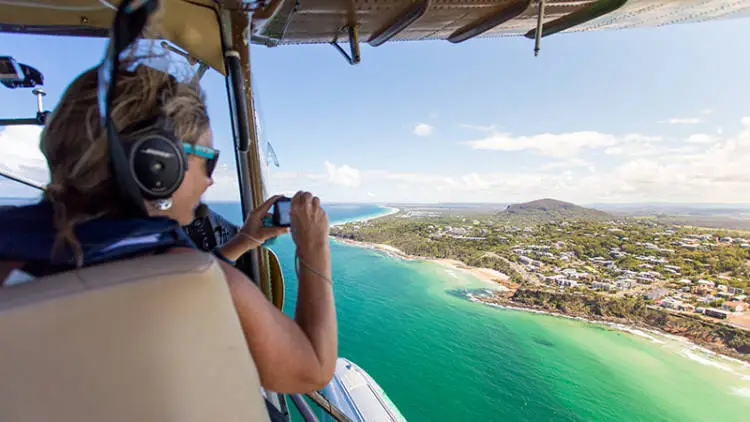 seaplane flying over sunshine coast